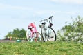 Two girl bicycles on a green meadow.